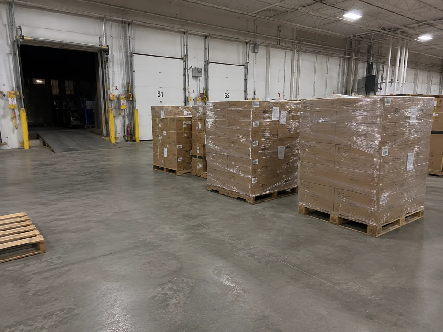 Pallets staged across a warehouse floor — when the top 8% of SKUs are scattered across this much real estate, every pick is a longer walk than it should be.